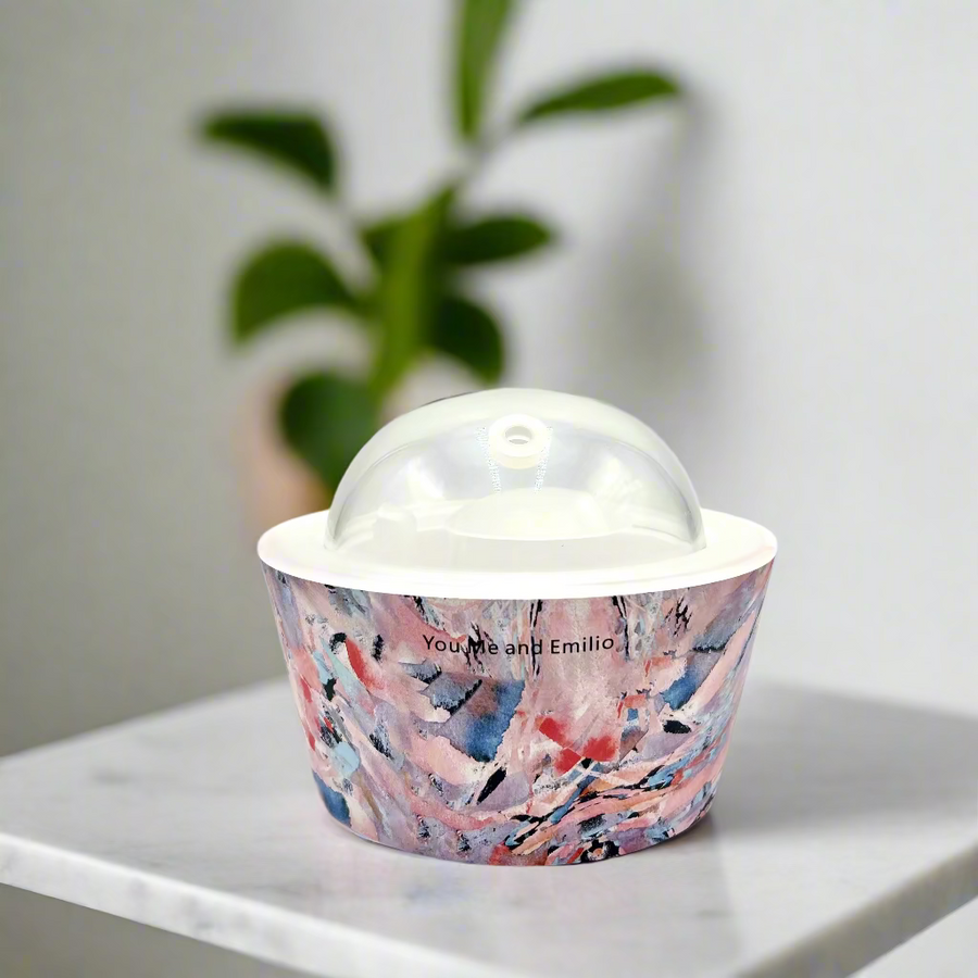 Ceramic bowl with a colorful abstract design on a white background