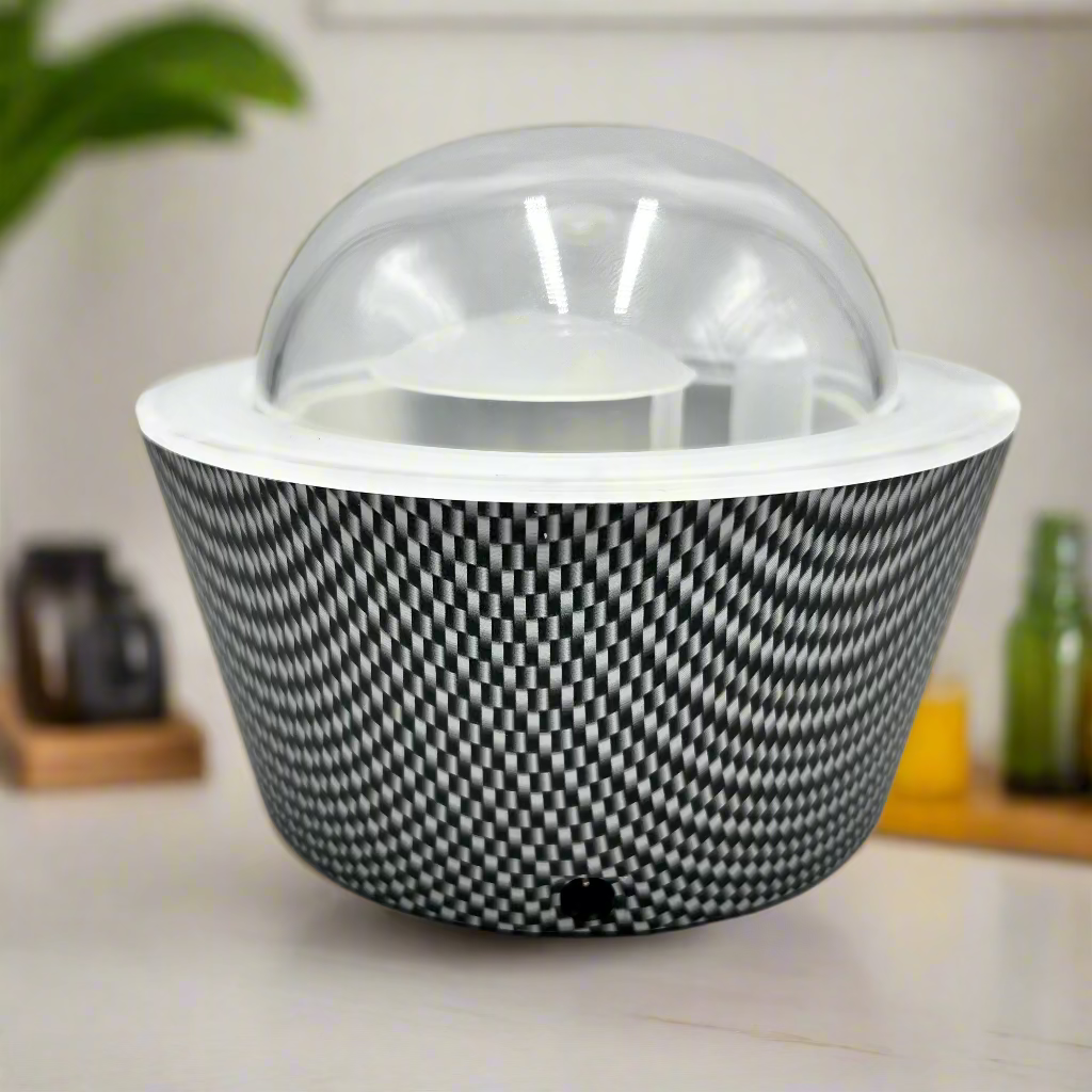 Black and white patterned basket with a transparent lid on a light gray background
