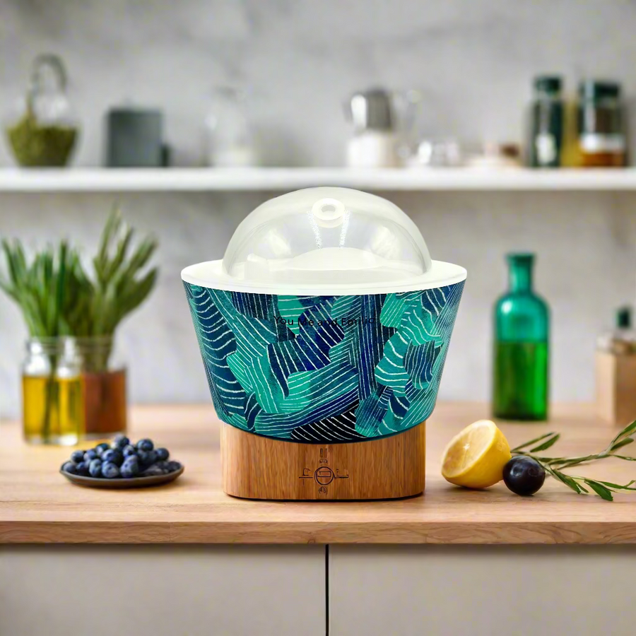 Bowl with a blue and green leaf pattern on a white background