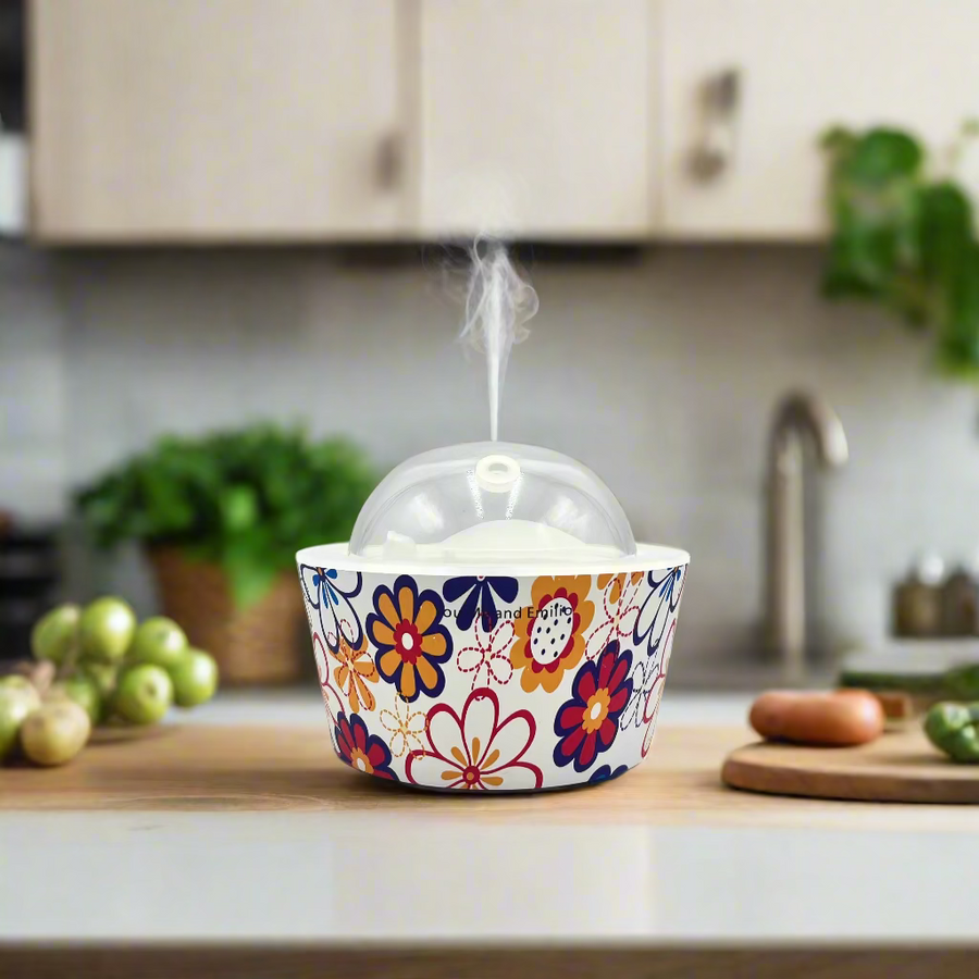 Colorful floral-patterned cupcake liner with a white cake on a gray background