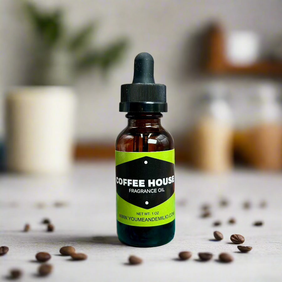 Coffee House Fragrance Oil placed beside a steaming vanilla latte and a sprinkle of vanilla pods, bringing the warm essence of a coffee shop to life.