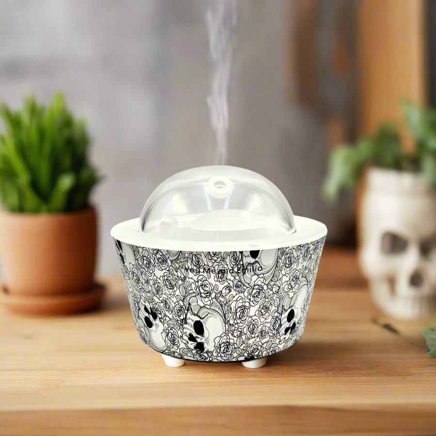 Decorative cupcake wrapper with skull design on a white background