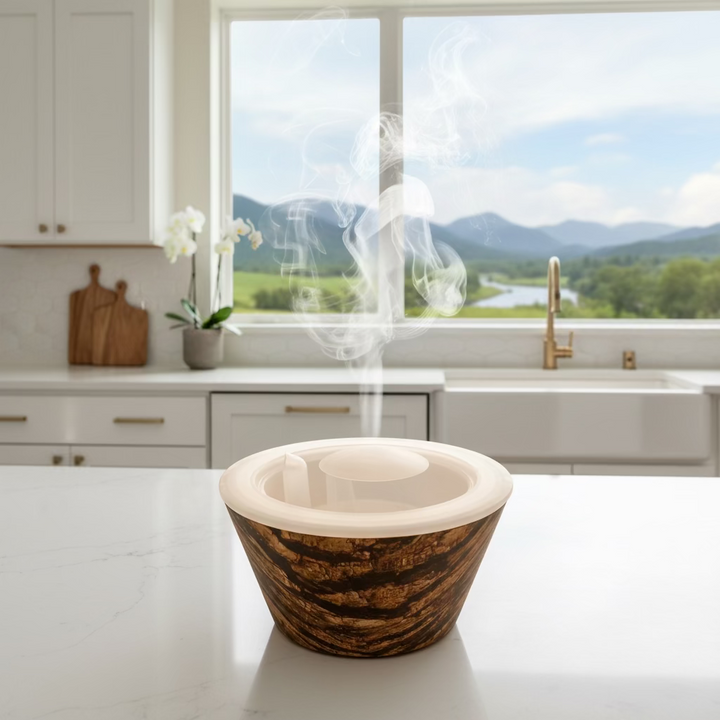 Plastic bowl with a textured brown exterior and clear lid on a white background