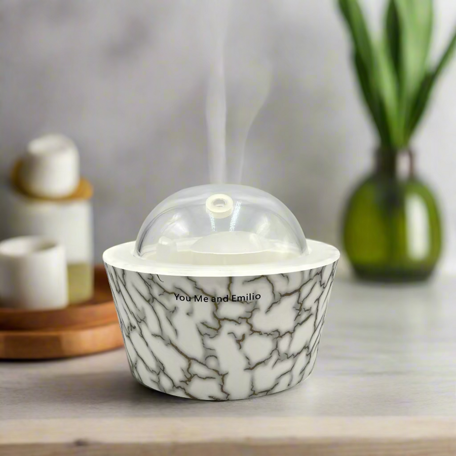 Marble-patterned container with a clear dome lid on a white background