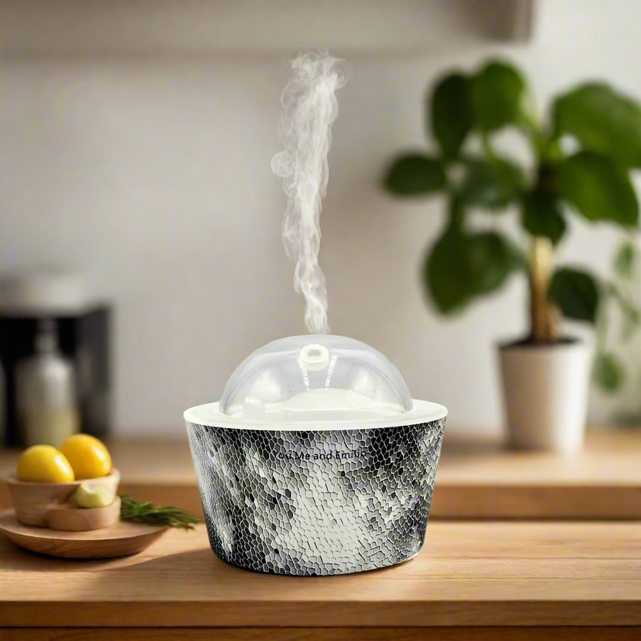Silver textured container with a clear dome lid on a white background