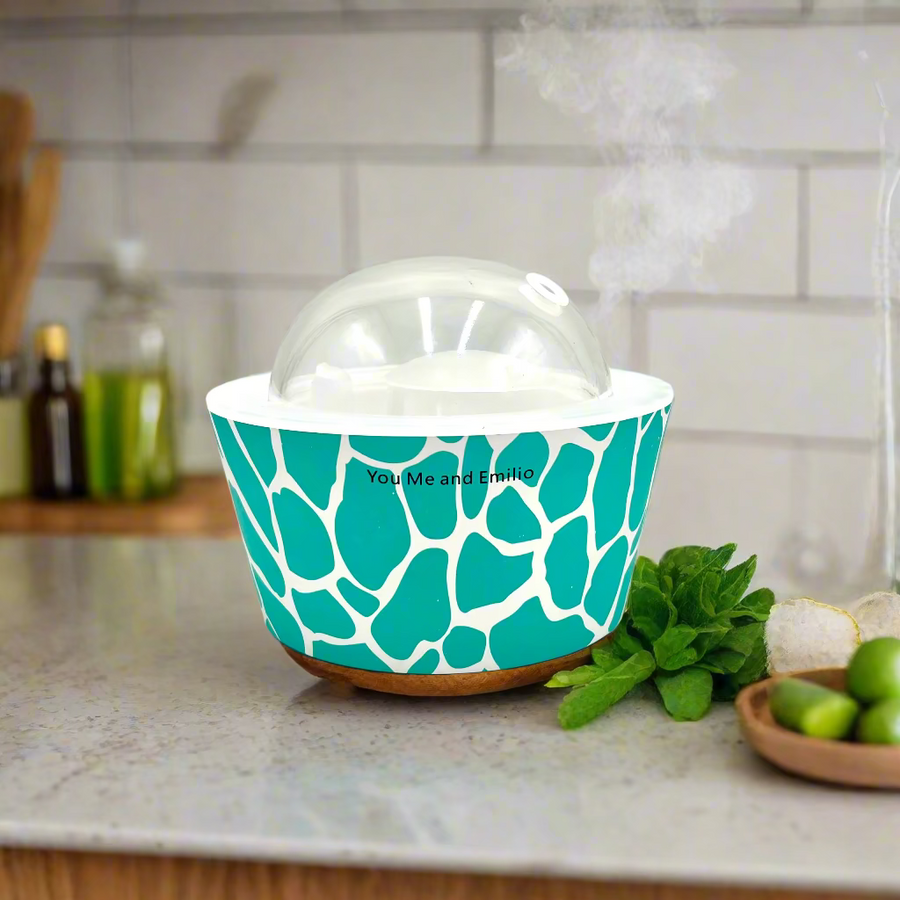 Teal patterned container with a clear lid on a white background