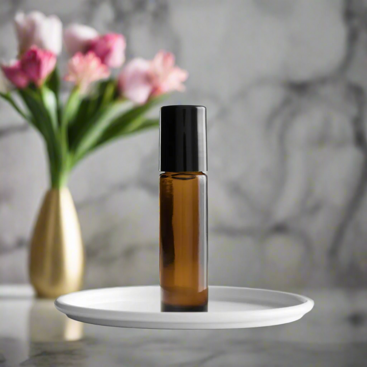 Amber glass bottle of Forty Scented Roll-On by You Me & Emilio, featuring bold musky and floral fragrance oil for daily wear, luxury scent rituals, and gifting.
