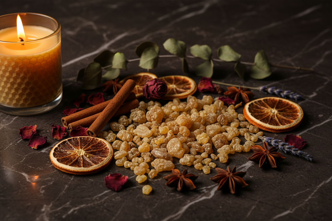 Frankincense resin crystals and botanicals on dark marble surface