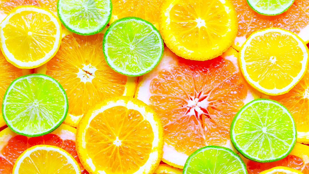 A collection of summer-themed soy candles, wax melts, room mists, and fragrance oils featuring vibrant scents like Grapefruit & Lime, Mango Banana, Lemon & Lime, and Beach Wood, evoking the refreshing essence of the season.