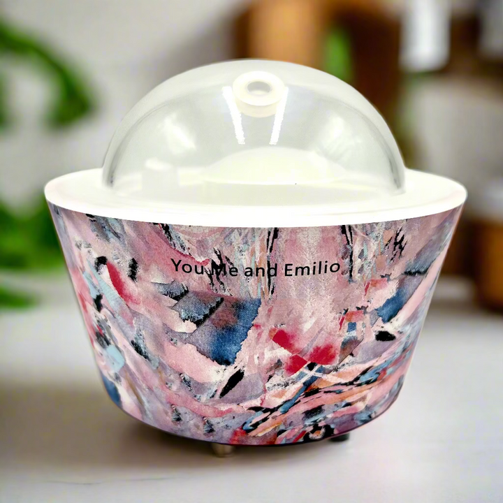Container with a colorful marbled design and 'You Me and Emilio' text on a white background