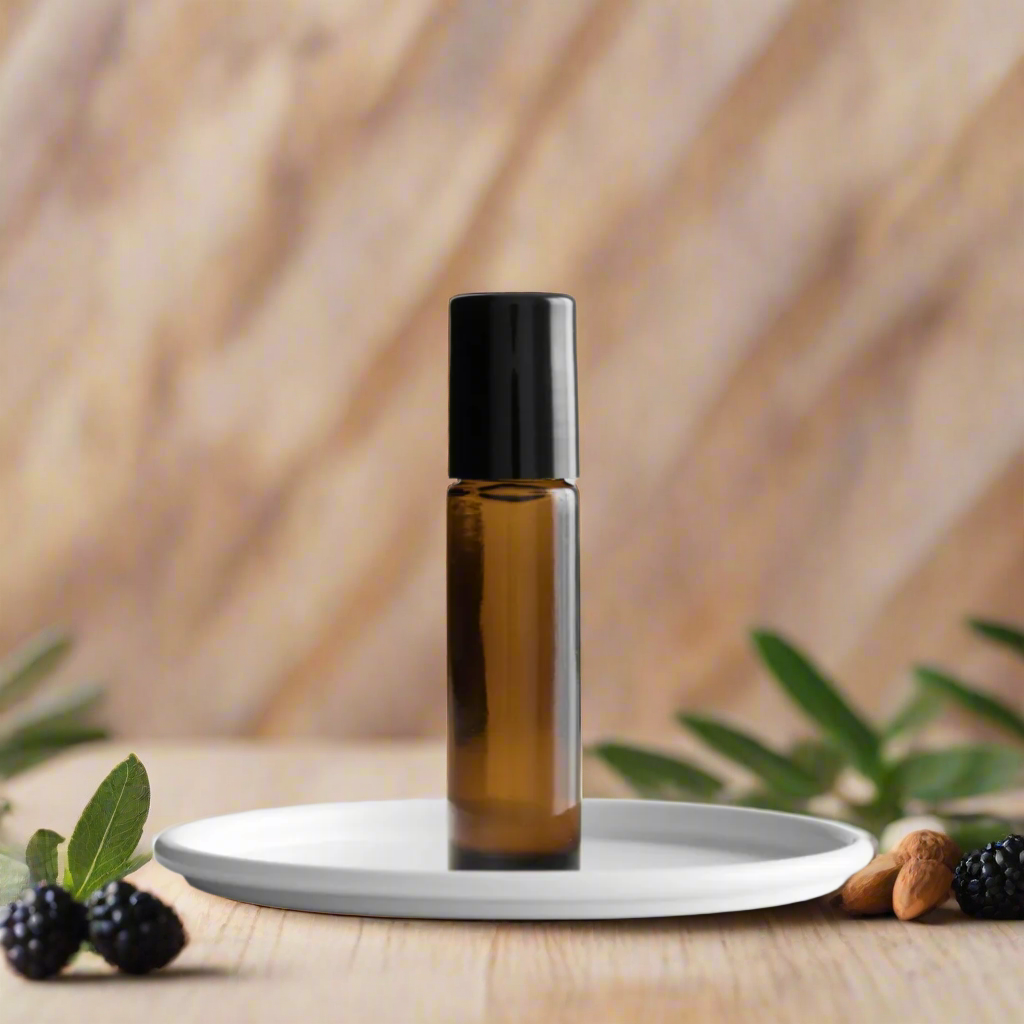 Amber bottle of Almond Blackberry Sage Roll-On Perfume Oil by You Me & Emilio, featuring notes of blackberry, sage, almond, and vanilla.