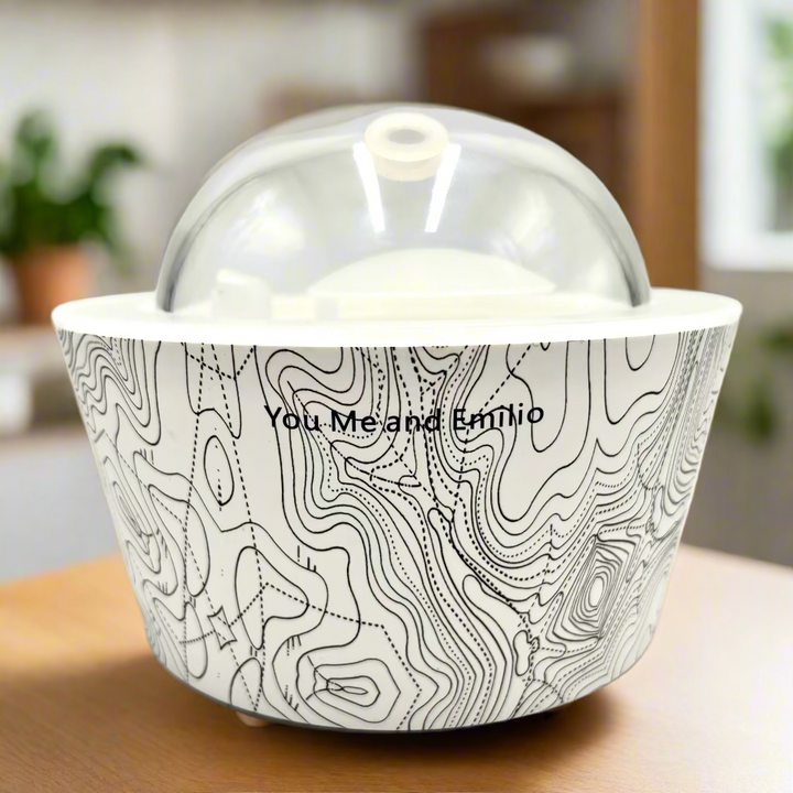 Ceramic container with lid featuring a black and white pattern on a white background