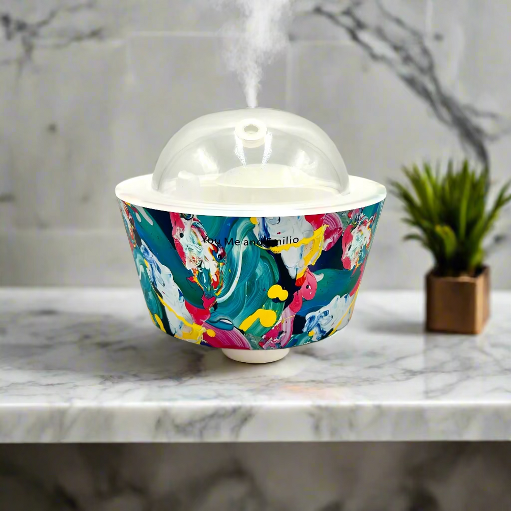 Colorful marbled patterned container with a clear dome lid on a white background