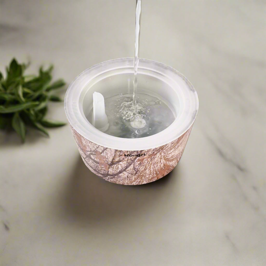 The Autumn Leaves Oil Diffuser in a cozy living room setting, creating a tranquil atmosphere.