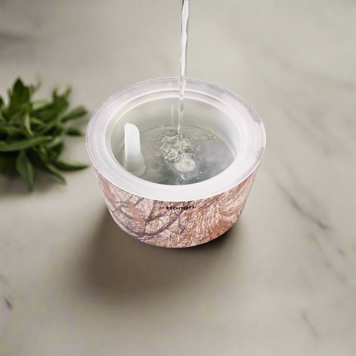 The Autumn Leaves Oil Diffuser in a cozy living room setting, creating a tranquil atmosphere.