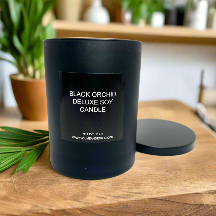 A warm glow from the Tom Ford Inspired Black Orchid Candle, enhancing an elegant ambiance with its rich fragrance.