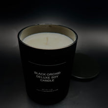 Tom Ford Inspired Candle. Limited-edition Black Orchid Deluxe Soy Candle glowing on a chic tabletop, evoking a luxurious and cozy atmosphere.
