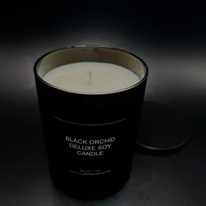 Tom Ford Inspired Candle. Limited-edition Black Orchid Deluxe Soy Candle glowing on a chic tabletop, evoking a luxurious and cozy atmosphere.
