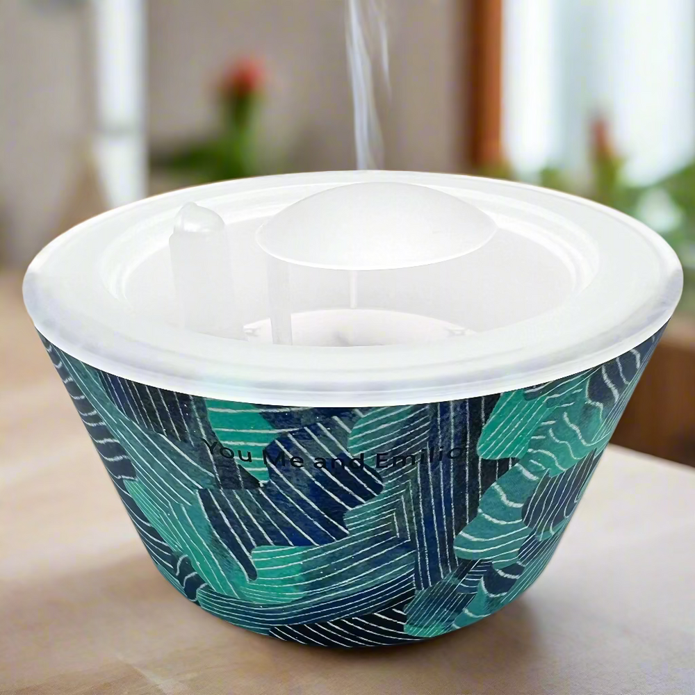 Container with green and blue patterned design on a white background