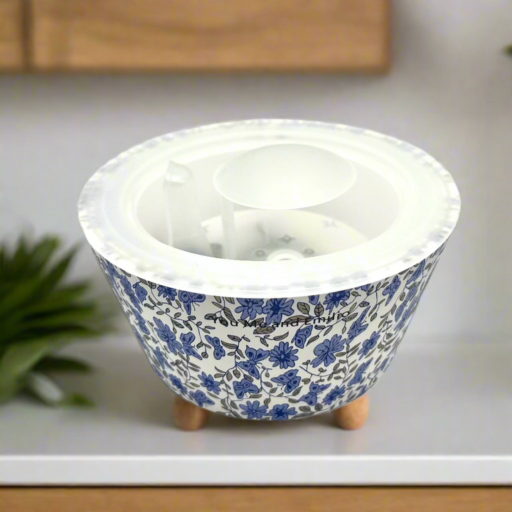 Ceramic bowl with blue floral pattern on a white background