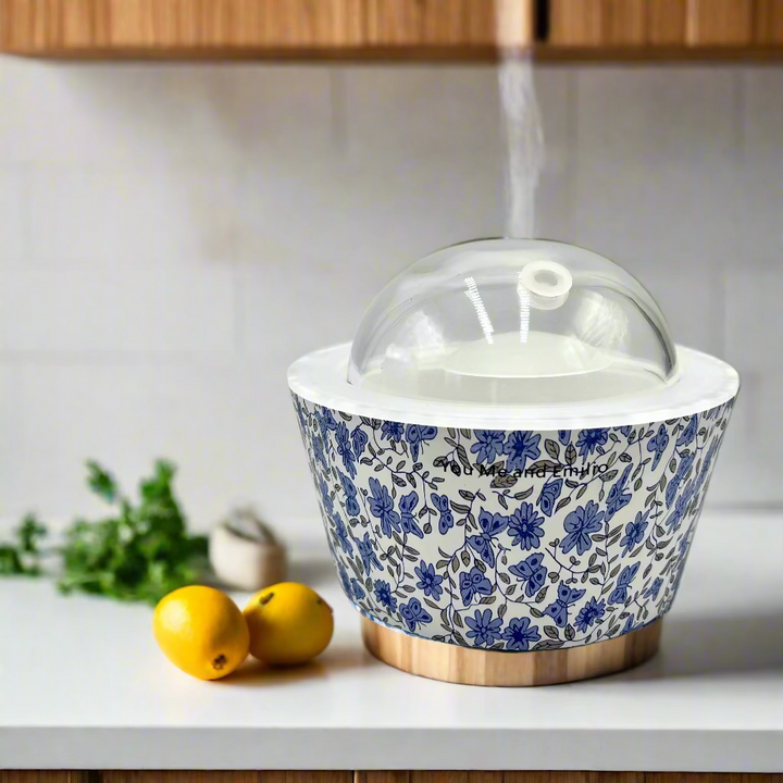 Blue floral-patterned container with a clear lid on a white background