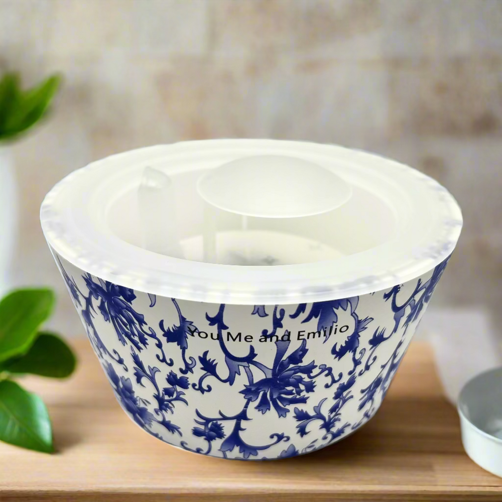 White bowl with blue floral pattern on a white background