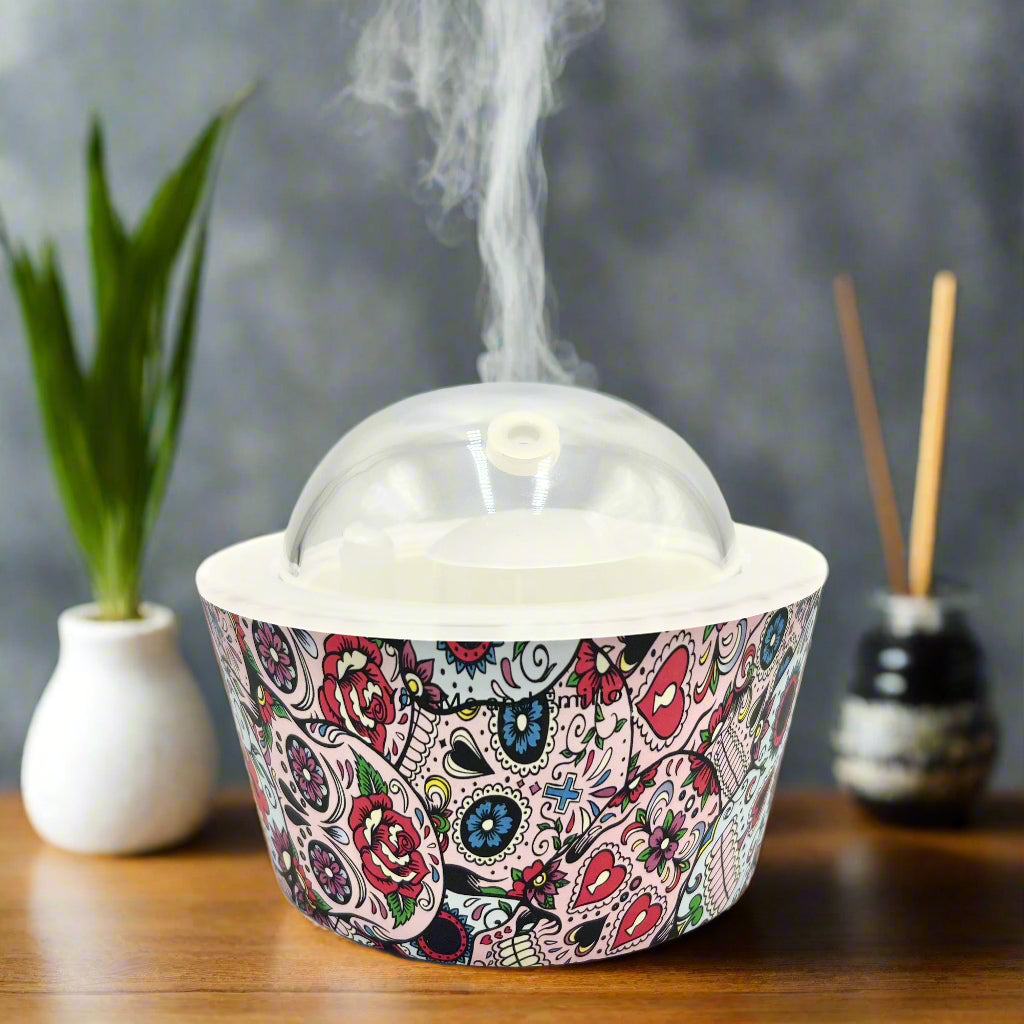 Bring calm and elegance to your space with our Day Of The Dead Catrina Oil Diffuser. Ultrasonic mist, 10-hour runtime & auto shut-off. Shop YOU ME & EMILIO.