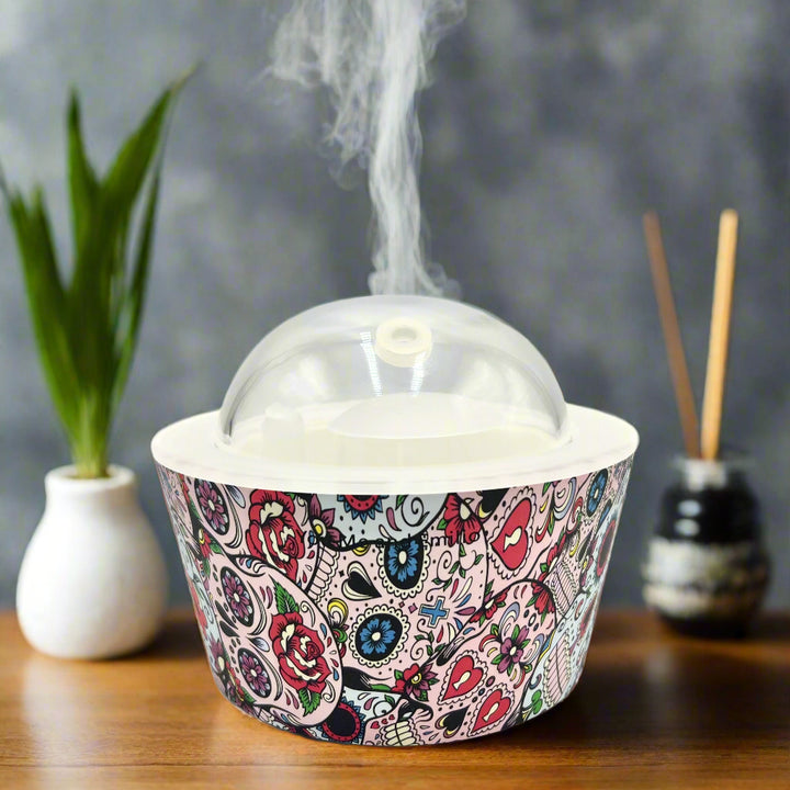 Bring calm and elegance to your space with our Day Of The Dead Catrina Oil Diffuser. Ultrasonic mist, 10-hour runtime & auto shut-off. Shop YOU ME & EMILIO.