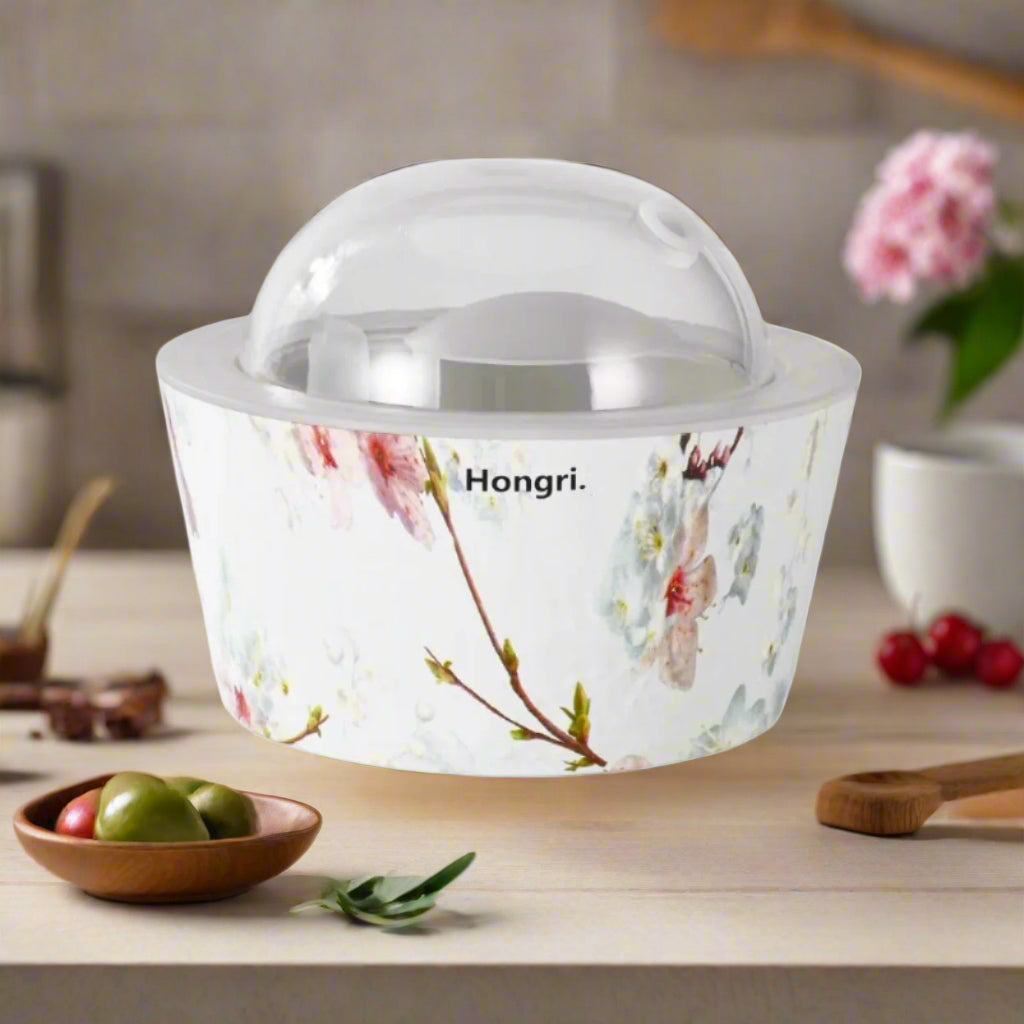 Cherry Blossom Essential & Fragrance Oil Diffuser emitting a soft mist, surrounded by delicate cherry blossom petals.