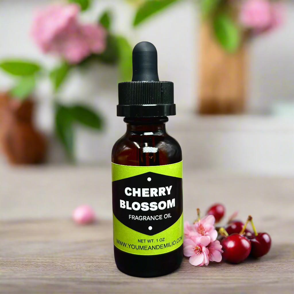 Cherry Blossom Fragrance Oil bottle with floral design, showcasing its luxurious, pure scent blend of cherry blossoms, jasmine, and peony. Hand-poured in Dallas, Texas.