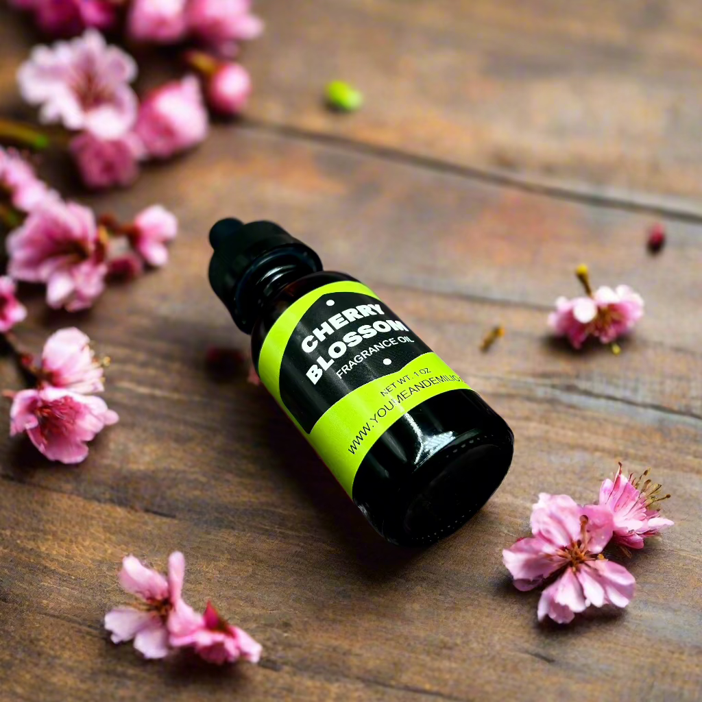 Cherry Blossom Fragrance Oil bottle with floral design, showcasing its luxurious, pure scent blend of cherry blossoms, jasmine, and peony. Hand-poured in Dallas, Texas.