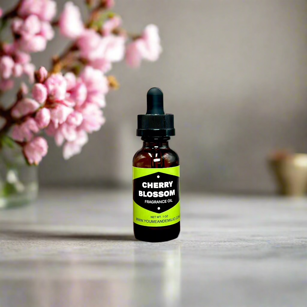 Cherry Blossom Fragrance Oil bottle with floral design, showcasing its luxurious, pure scent blend of cherry blossoms, jasmine, and peony. Hand-poured in Dallas, Texas.