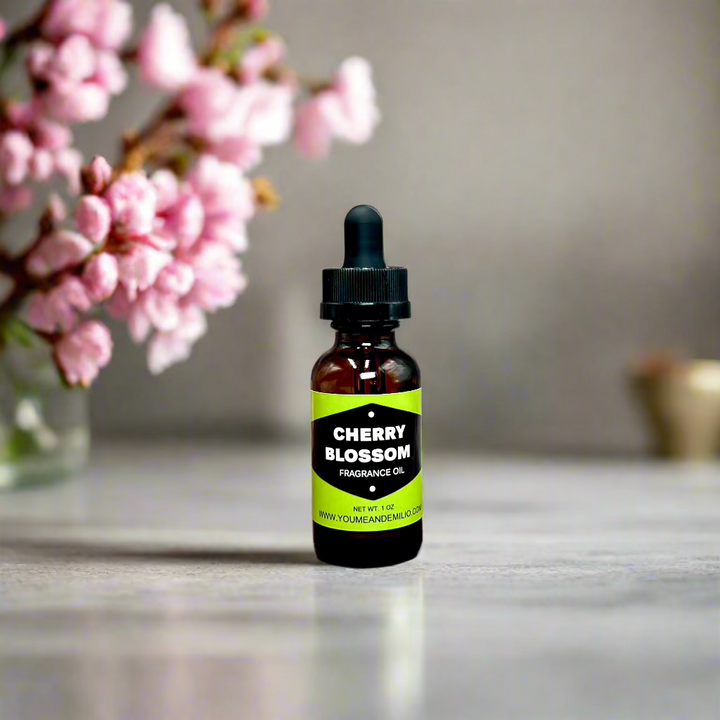 Cherry Blossom Fragrance Oil bottle with floral design, showcasing its luxurious, pure scent blend of cherry blossoms, jasmine, and peony. Hand-poured in Dallas, Texas.