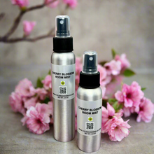 Cherry Blossom Room Mist – A premium, long-lasting home fragrance spray infused with the fresh scent of cherry blossoms and red cherries. Hand-poured in Dallas, Texas, this elegant mist eliminates odors and refreshes any space.