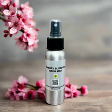 Cherry Blossom Room Mist – A premium, long-lasting home fragrance spray infused with the fresh scent of cherry blossoms and red cherries. Hand-poured in Dallas, Texas, this elegant mist eliminates odors and refreshes any space.