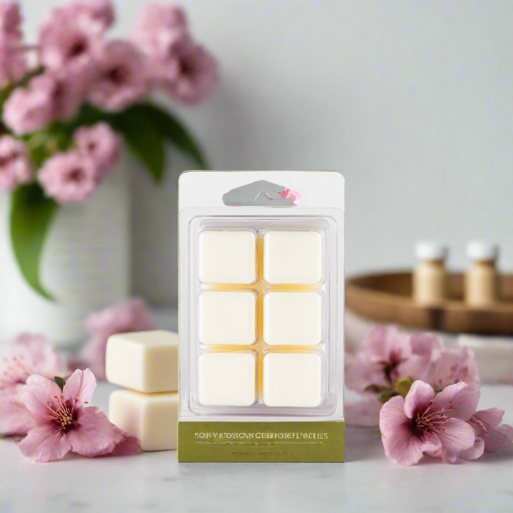 Cherry Blossom Soy Wax Melts displayed in a decorative dish, with the soft pink hues of cherry blossoms surrounding them, emphasizing their floral and fruity fragrance.
