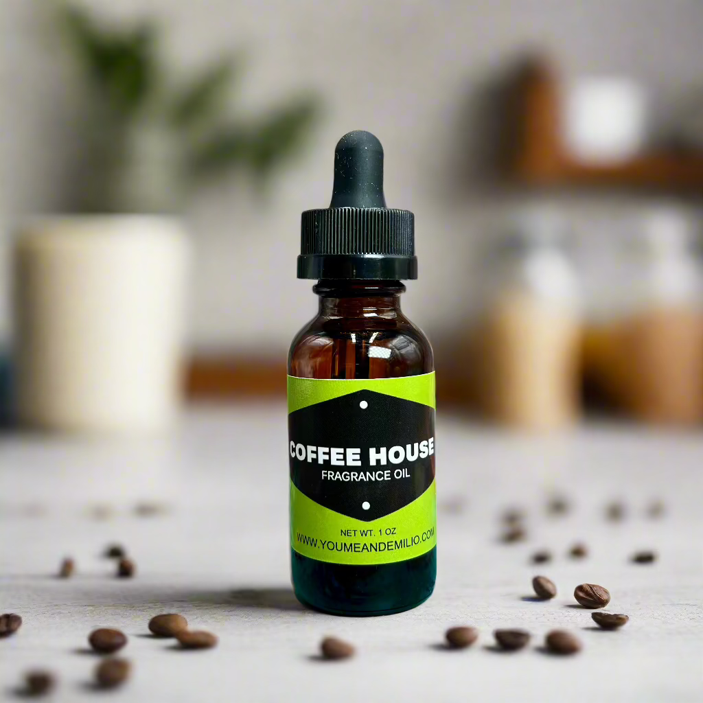 Coffee House Fragrance Oil placed beside a steaming vanilla latte and a sprinkle of vanilla pods, bringing the warm essence of a coffee shop to life.