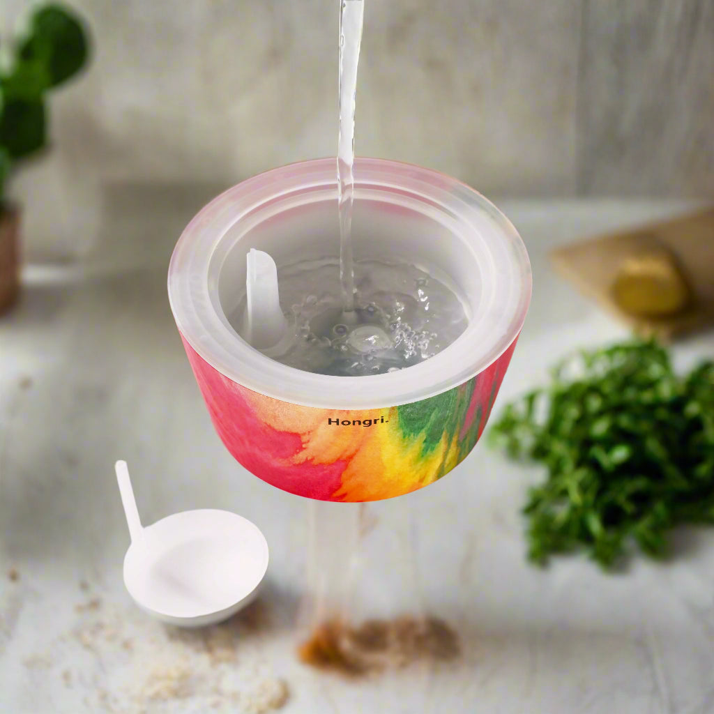 The Color Me Diffuser glowing with a colorful mist in an elegant and contemporary home decor setup.