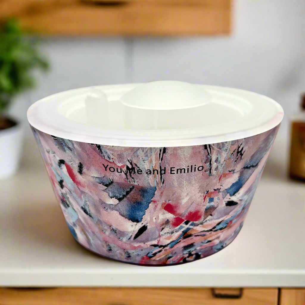 Ceramic bowl with abstract multicolor design on a white background