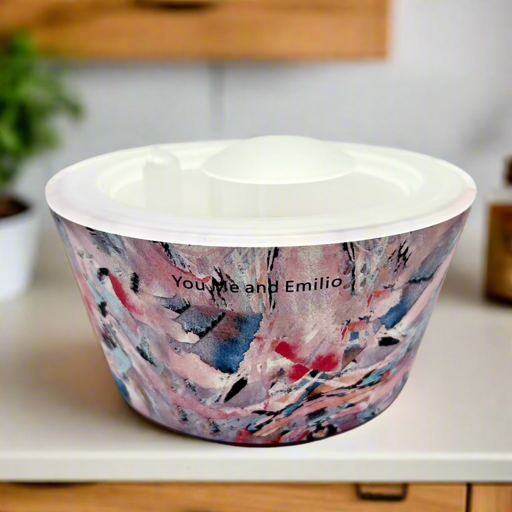 Ceramic bowl with abstract multicolor design on a white background