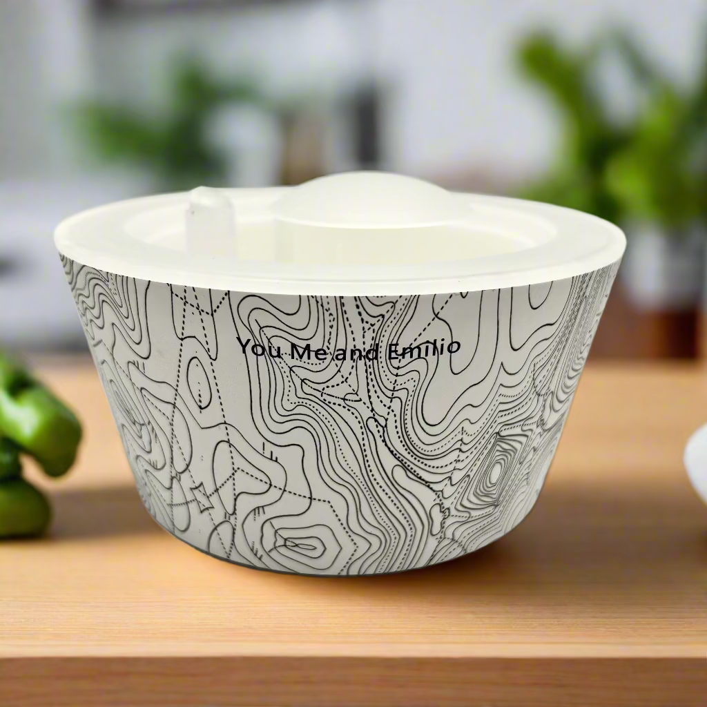 White ceramic bowl with black abstract pattern and 'You Me and Emilio' text on a white background