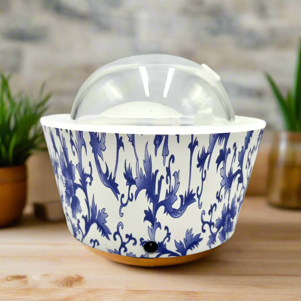 Ceramic ice cream container with blue floral pattern on a white background