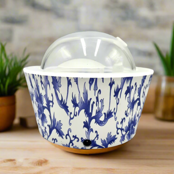 Ceramic ice cream container with blue floral pattern on a white background