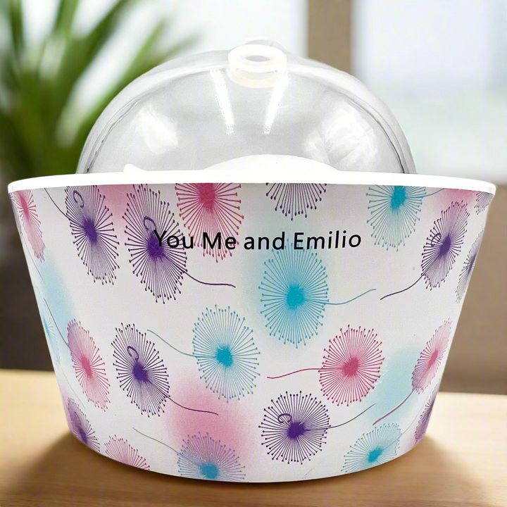Decorative bucket with floral pattern and 'You Me and Emilio' text on a white background