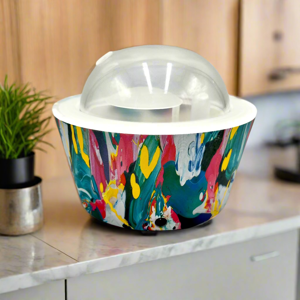 Colorful abstract-patterned container with a clear dome lid on a white background