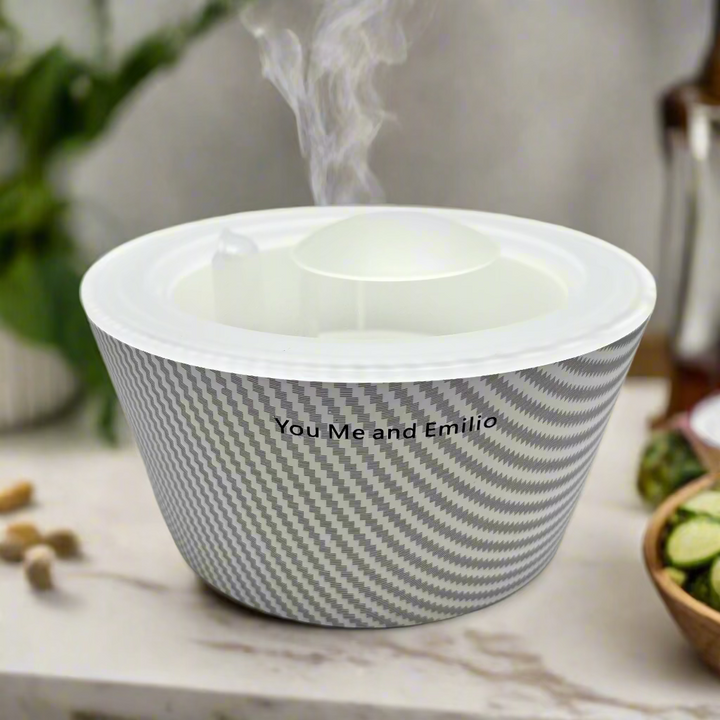 Gray and white striped container with 'You Me and Emilio' text on a light gray background