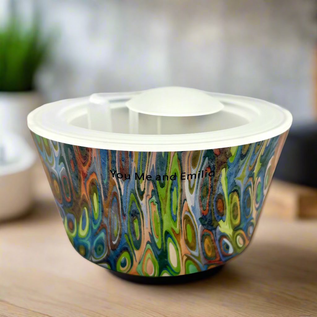 Colorful pet bowl with abstract design on a white background