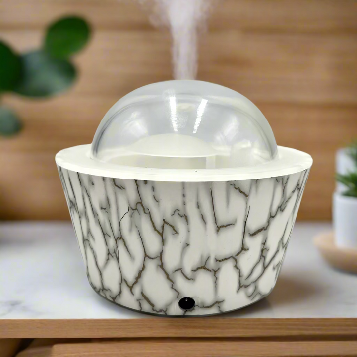 Marble-patterned container with a clear dome lid on a white background