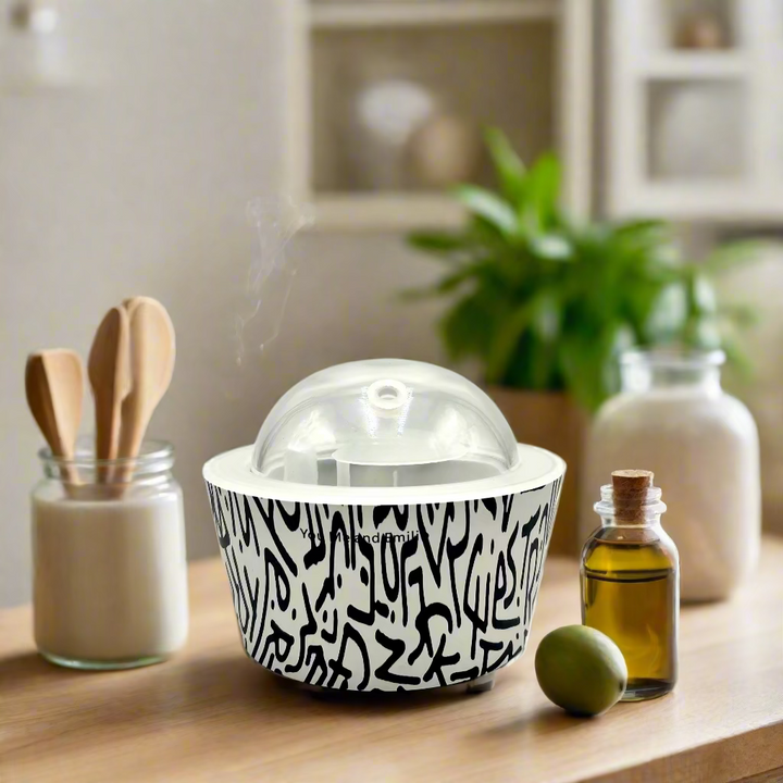 Black and white patterned container with a clear dome lid on a white background