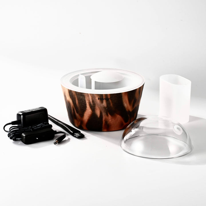 Flame Essential & Fragrance Oil Diffuser on a modern side table, enhancing a tranquil living space with its soothing mist.